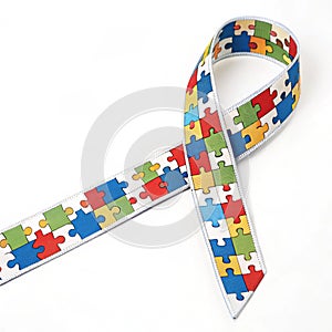 Ribbon with puzzle pieces isolated on white background photo