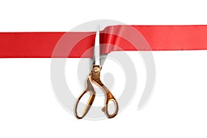 Ribbon and scissors on white background