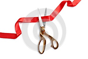 Ribbon and scissors on white background