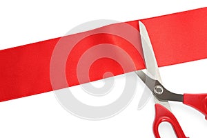 Ribbon and scissors on white background, top view