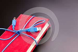 Ribbon from the usb cable on book