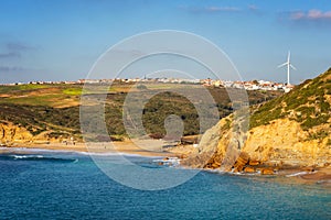 Ribeira dilhas beach in Ericeira with turquoise water on a sunny day, in Portugal