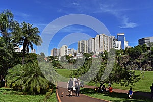 People enjoying sunny day on public park in Ribeirao Preto, Brazil