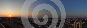 RIBEIRAO PRETO, SAO PAULO, BRAZIL - Sundown at avenue and buildings in city - Panoramic view