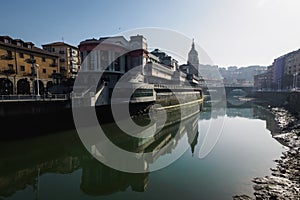 The Ribera market and the church of San Anton of Bilbao seen from the river