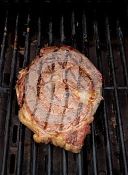 Ribeye Steak grilling on a Barbecue