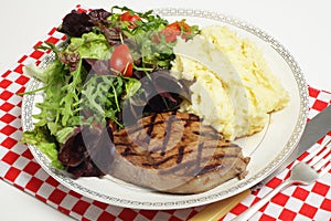 Ribeye steak with salad and celeriac potatoes photo