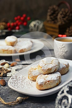Ricciarelli, gluten free almond cookies. Italian traditional Christmas cookies and coffee. New year decoration