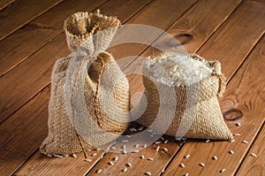 Rice in bags on a wooden table