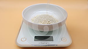 Rice being weighed on digital kitchen scales