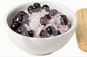 Rice berry in bowl, cut out on white background