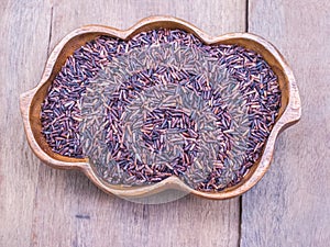 Rice berry in wooden bowl
