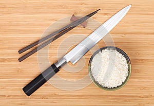 Rice bowl, chopsticks and sushi knife