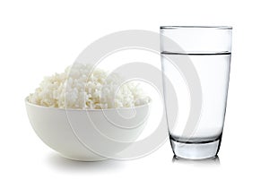 Rice in a bowl and Glass of water on white background