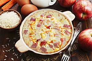 Rice casserole with apples and carrots photo