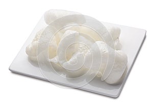 Rice chips or krupuk on white plate. File contains clipping path photo