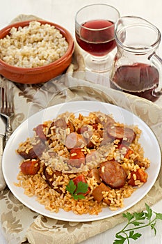 Rice with chorizo and sausages and wine