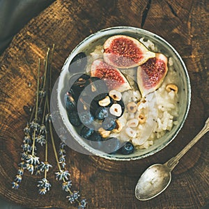 Rice coconut porridge with figs, berries and hazelnuts, square crop