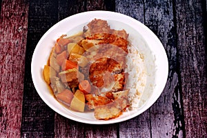 Rice with deep fried dolly fish in japanese yellow curry.