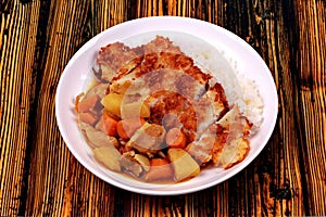 Rice with deep fried dolly fish in japanese yellow curry.