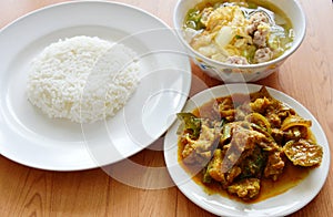 Rice eat with spicy stir fried wild boar curry and egg soup