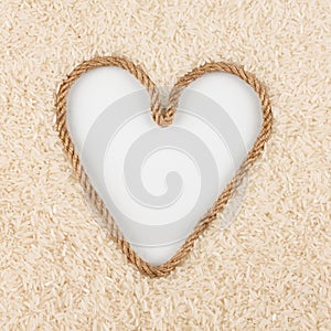 Rice grains and a rope in the shape of a heart with a place for designers.