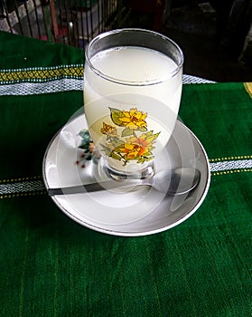 Rice gruel in the glass.  It is a nutritious drink.