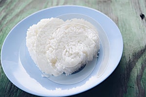 Rice laid out in a heart shape on blue plate