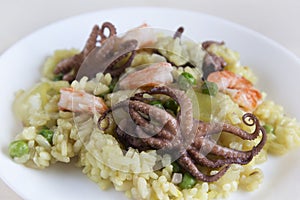 Rice with mini octopuses and green peas