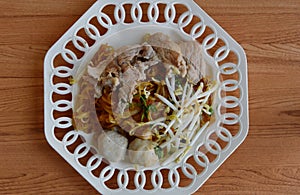 Rice noodle filling pork ball and bean sprout on plate