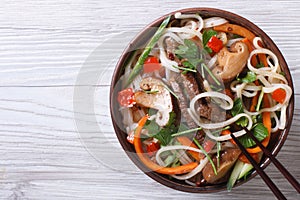 Rice noodles with meat, vegetables and shiitake top view