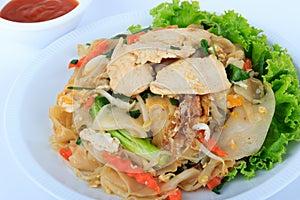 Rice Noodles Stir-fried with Chicken. Thai Street Food. photo