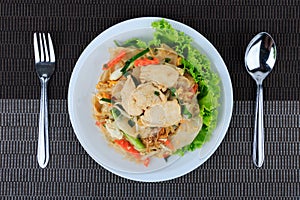 Rice Noodles Stir-fried with Chicken. Thai Street Food. photo