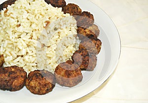 Rice pilaff with baked meatballs photo