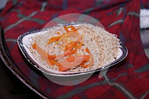 Rice on plate with carrot slices, Close up view - Food Photography