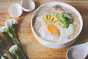 Rice porridge with ground pock vintage tone with white flowers o