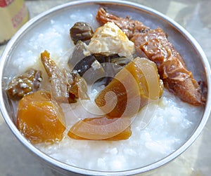 Rice porridge with pickled cucumber