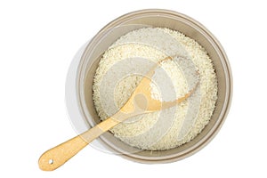 Rice in pot and a wood ladle