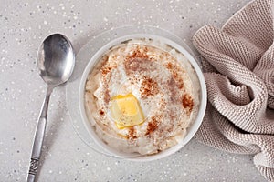 Rice pudding with butter cinnamon. french riz au lait, norwegian risgrot, traditional breakfast dessert