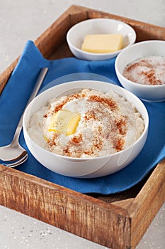 rice pudding with butter cinnamon. french riz au lait, norwegian risgrot, traditional breakfast dessert photo