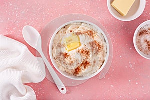 rice pudding with butter cinnamon. french riz au lait, norwegian risgrot, traditional breakfast dessert photo