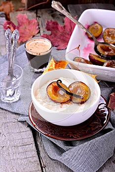 Rice pudding with caramel vanilla plums photo