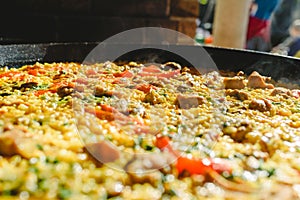 Rice and rabbit, typical dish of the gastronomy of the region of Murcia, Spain, cooked in a paella pan