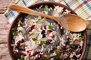 Rice with red beans in a bowl close-up on the table. horizontal photo