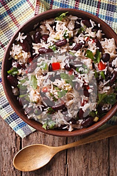 Rice with red beans and vegetables in a bowl close-up. vertical photo