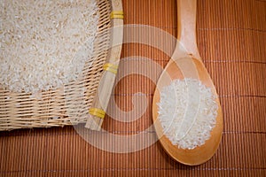 The rice in a rice scoop and bamboo basket