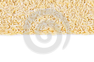 Rice-shaped pasta texture. Rice shaped pasta isolated on white background. Close-up. Shallow depth of field