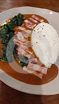 Rice with Smoked Bacon Spinach Japanese Curry. photo