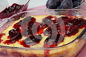 Rice souffle with plums in glass pan