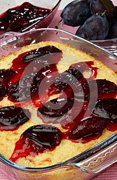 Rice souffle with plums in glass pan